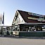 B25-Imbiss in Purgstall – Holz-Riegel-Konstruktion mit Wintergarten, Galerie, Sichttramdecke, Sichtdachstuhl, Vordächer und Terrassenüberdachung