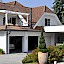Terrassenüberdachung und Carport in Gresten – Loggia mit Dachverglasung in Leimholz Sicht, Carport mit Flachdachkonstruktion