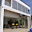 Terrassenüberdachung/Poolhaus in Gresten –Wintergartenkonstruktion mit Sichtdachstuh lGipskarton-Untersicht kombiniert, große Faltschiebetür für maximale Öffnungslichte