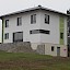 Niedrigstenergiehaus in Wallsee - Holzriegelhaus mit Walmdachstuhl und Garage mit Flachdach, Putzfassade